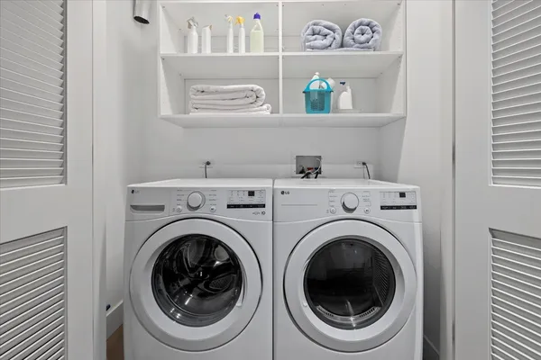 a utility room with dryer and washer