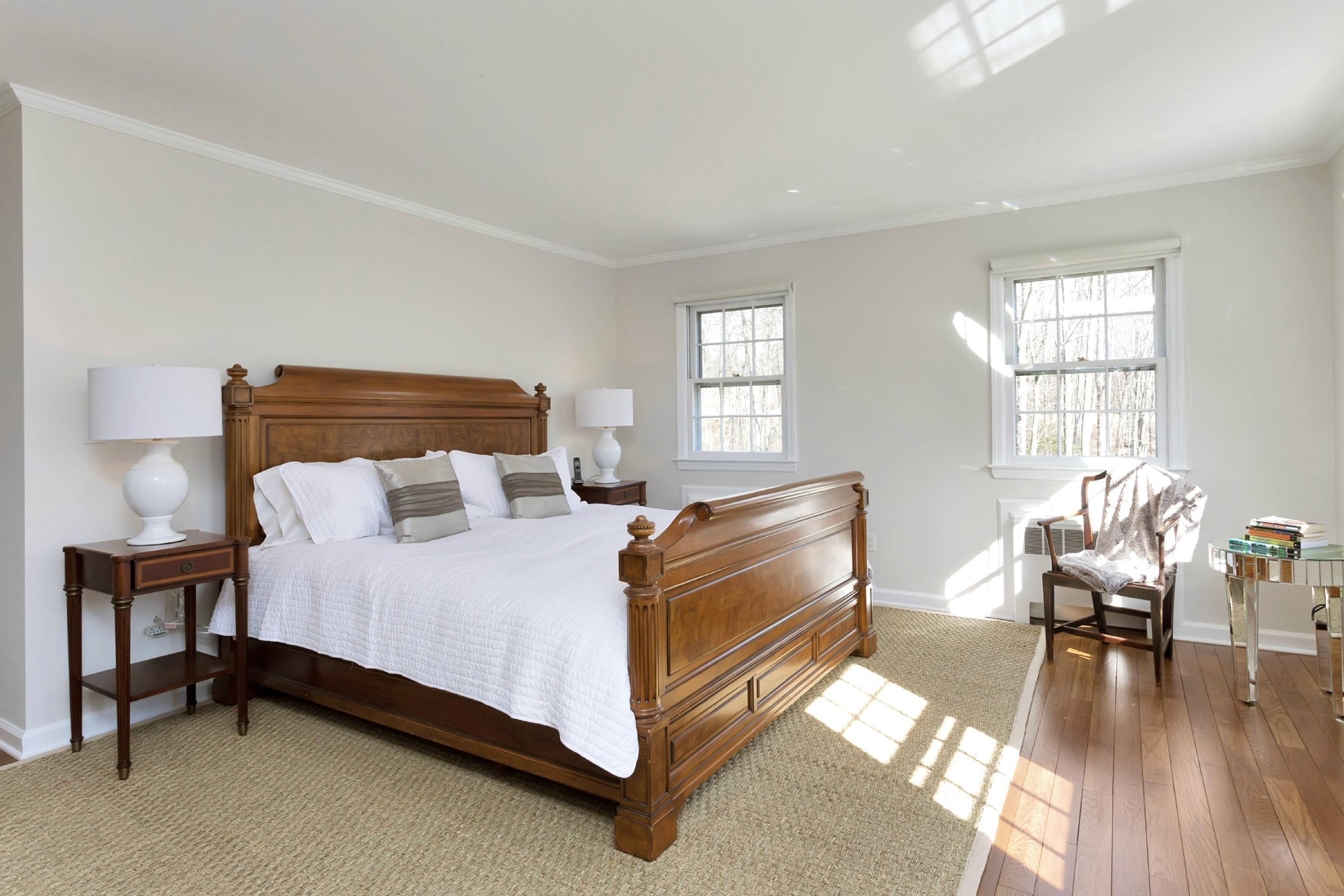 483 Middlesex Road Darien, CT 06820 - Photo 14 of 27 a bedroom with a bed and wooden floor