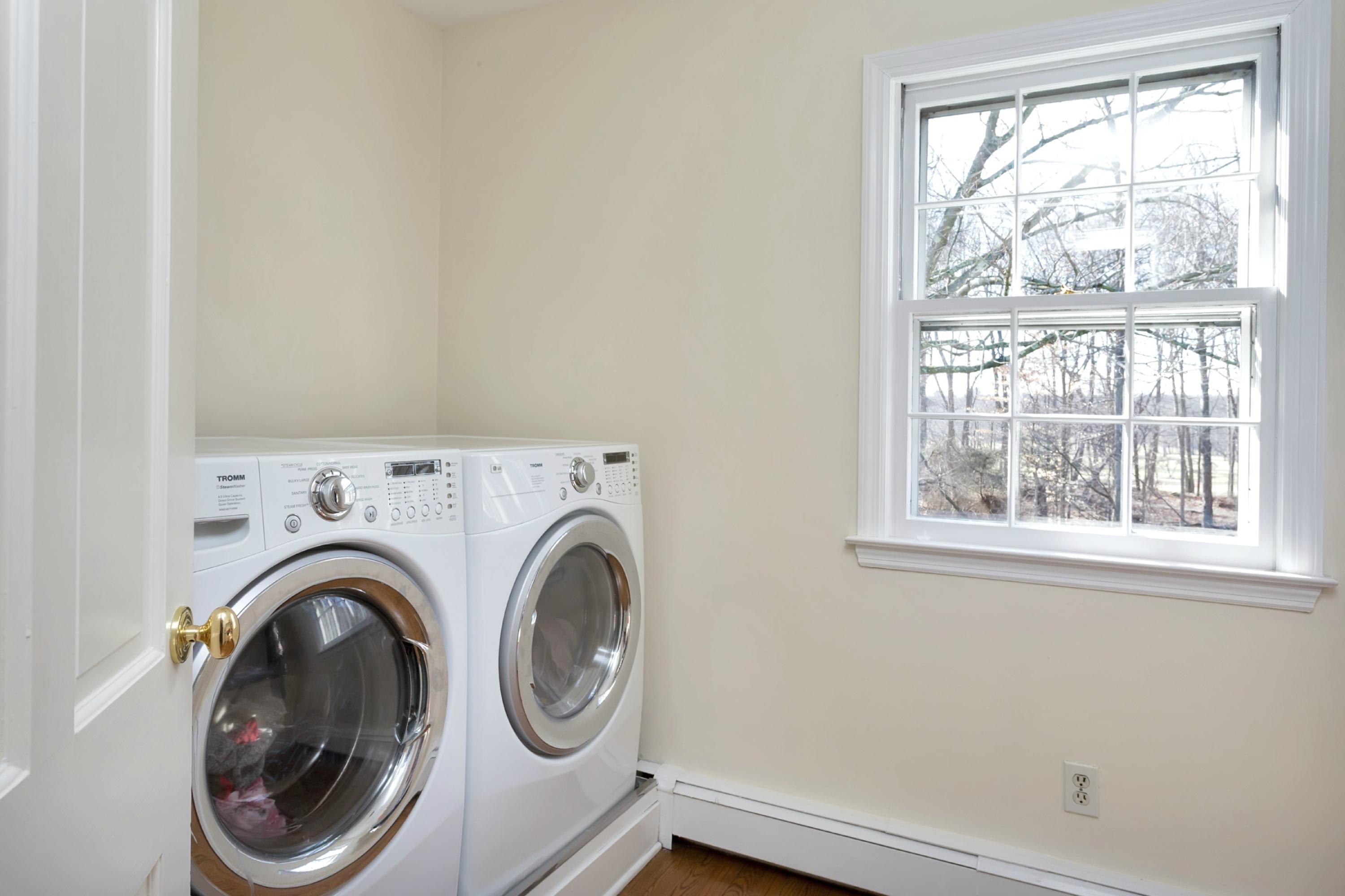 483 Middlesex Road Darien, CT 06820 - Photo 17 of 27 a view of livingroom with washer and dryer