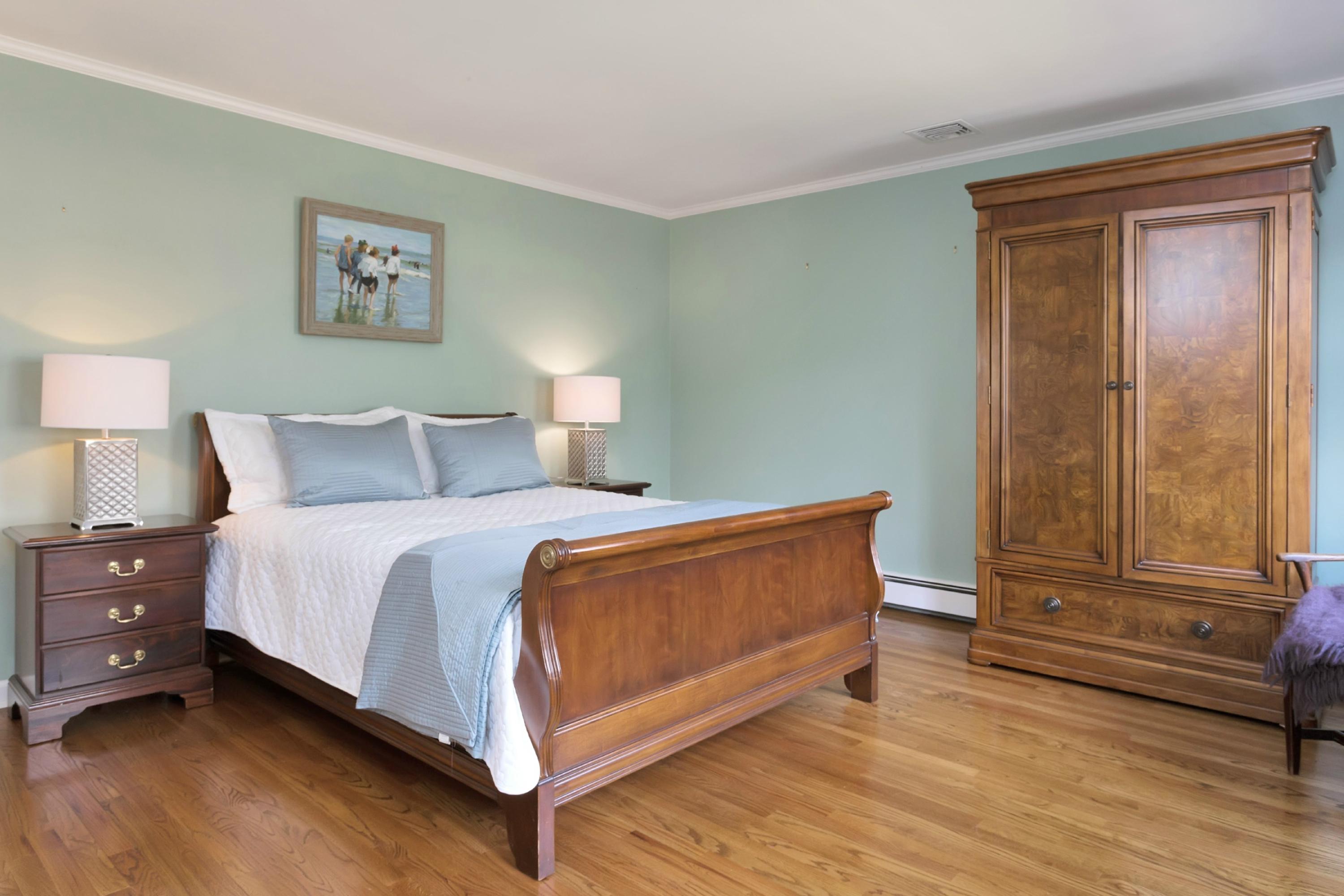 483 Middlesex Road Darien, CT 06820 - Photo 21 of 27 a bedroom with a bed and window