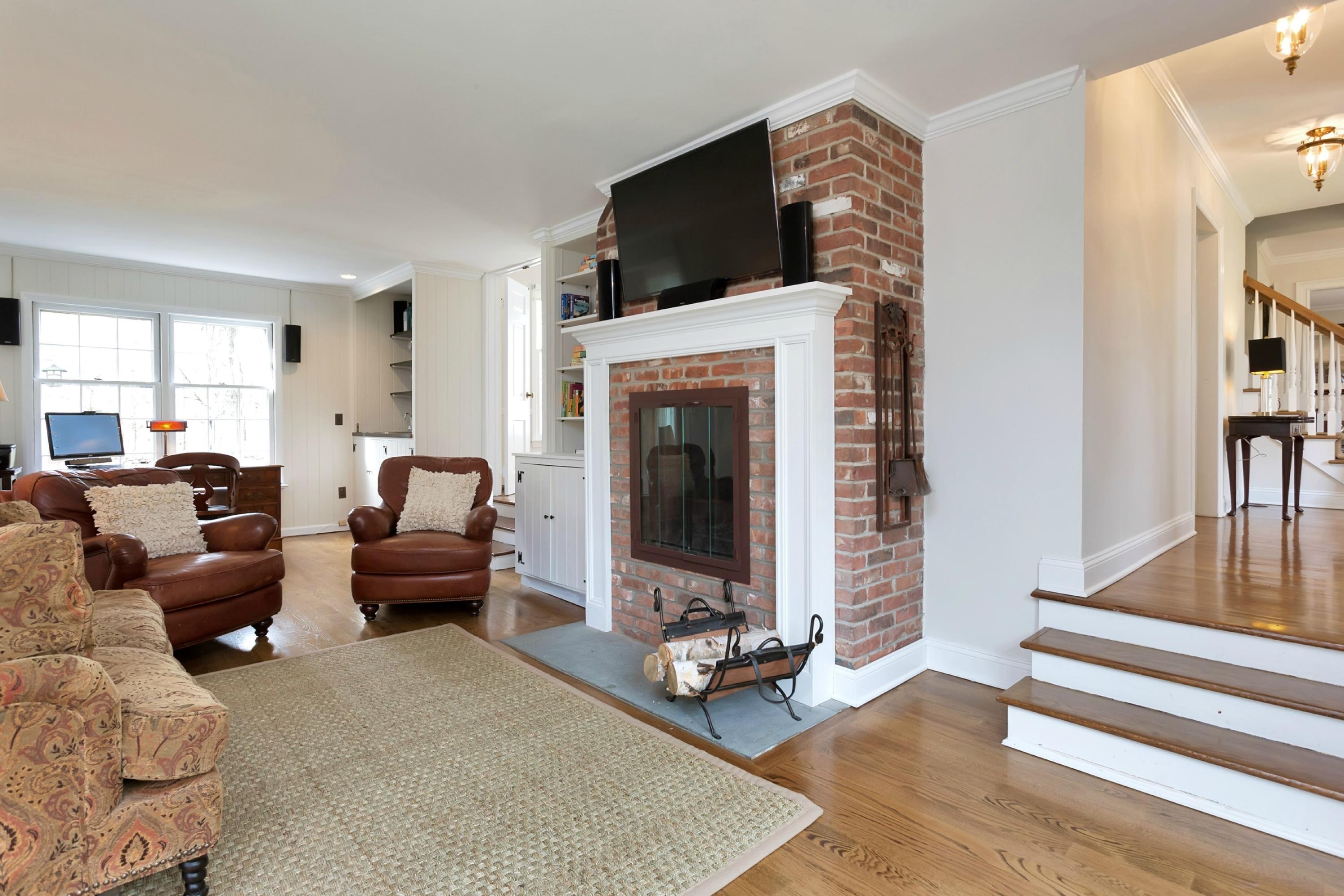483 Middlesex Road Darien, CT 06820 - Photo 9 of 27 a living room with furniture and a fireplace