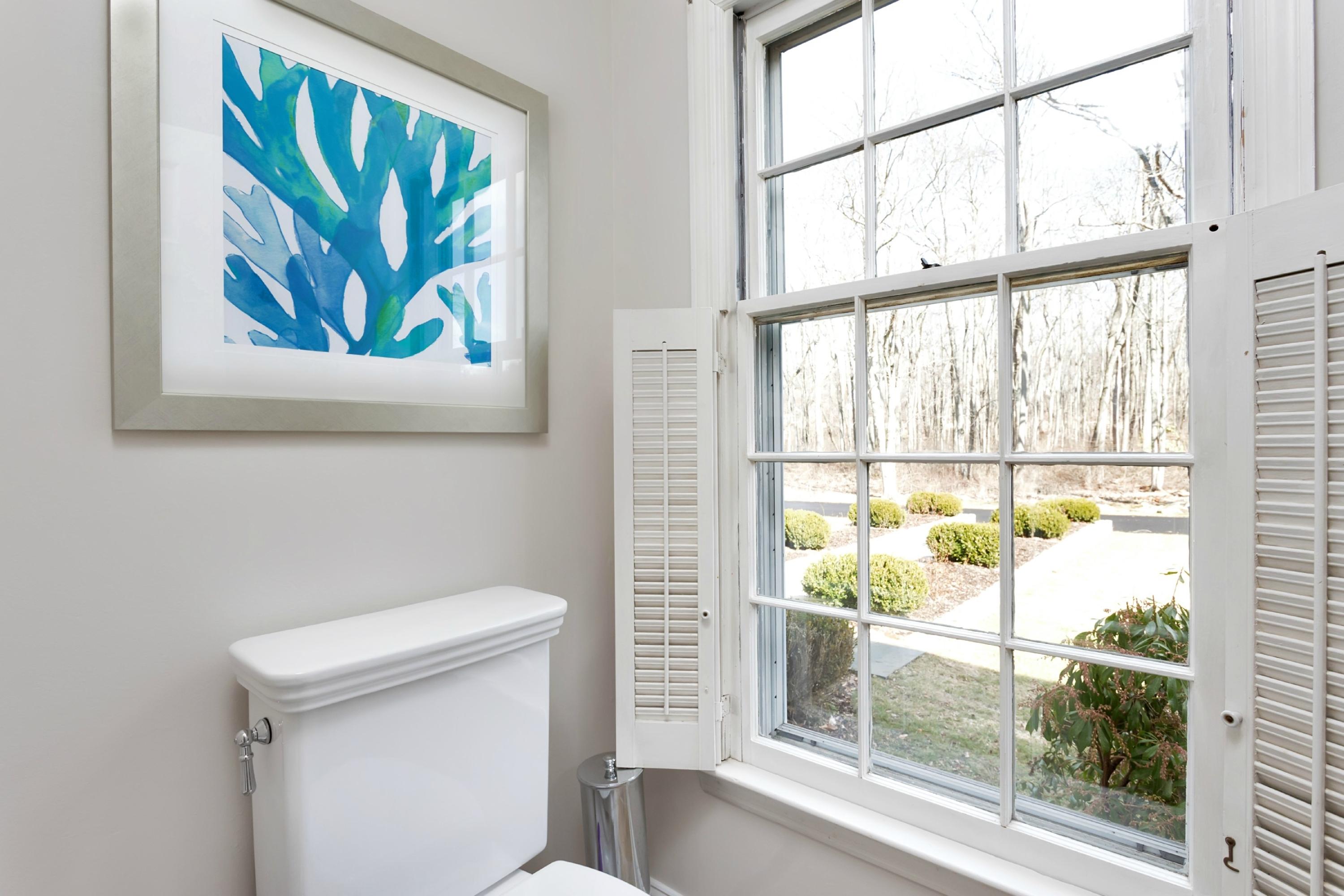 483 Middlesex Road Darien, CT 06820 - Photo 10 of 27 a bathroom with a toilet and a window