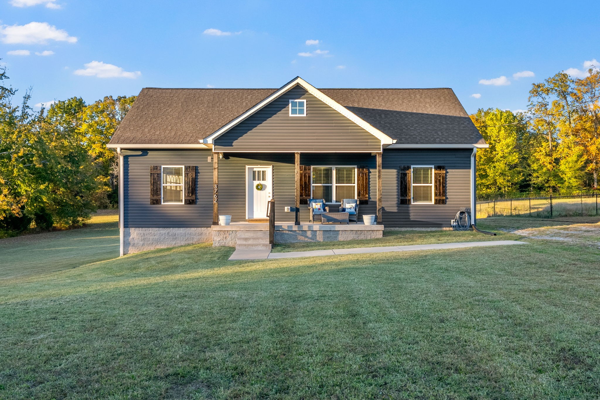 3762 Bowker Road Charlotte, TN 37036 - Photo 1 of 1 a front view of a house with a yard