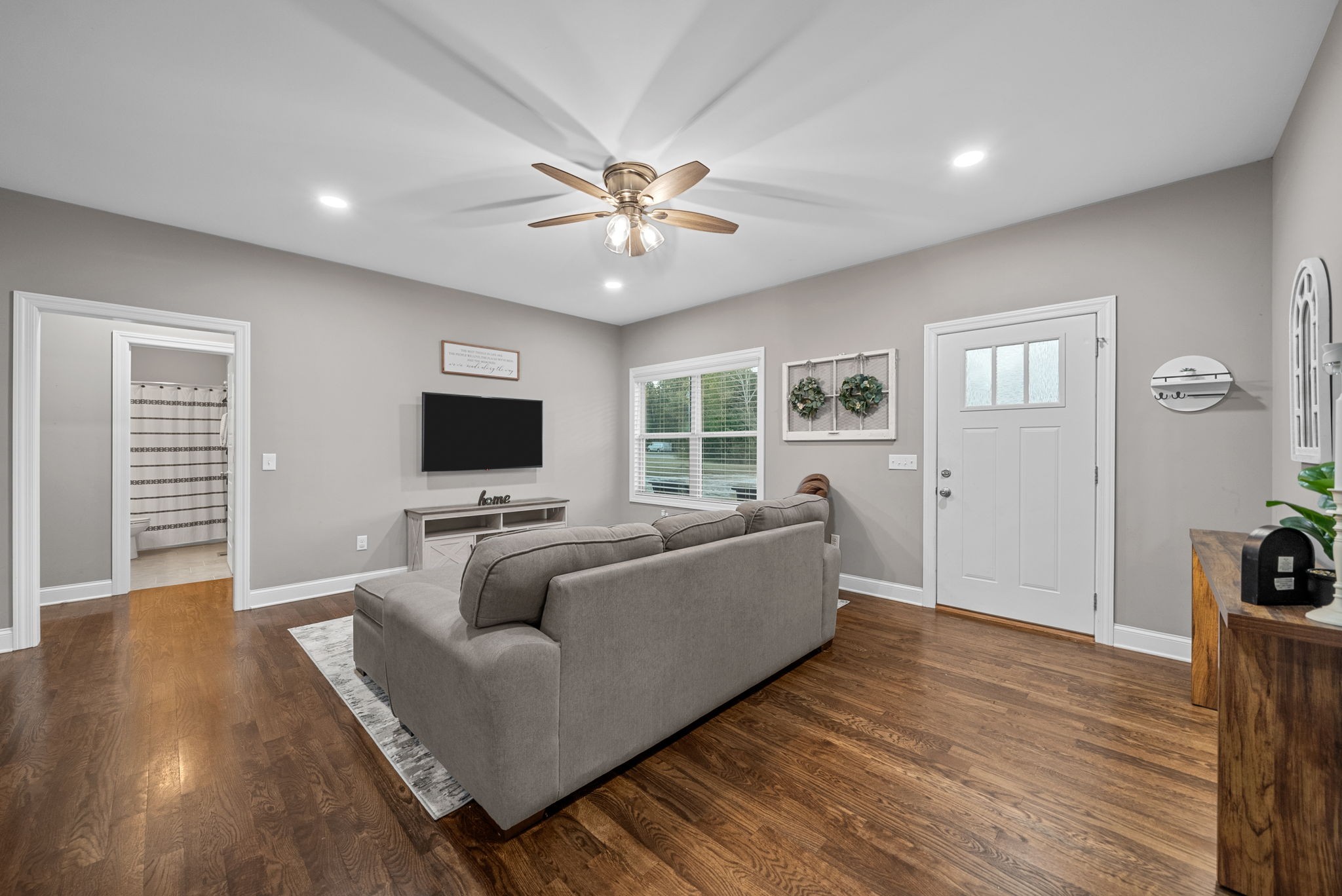3762 Bowker Road Charlotte, TN 37036 - Photo 11 of 35 a living room with furniture and a flat screen tv