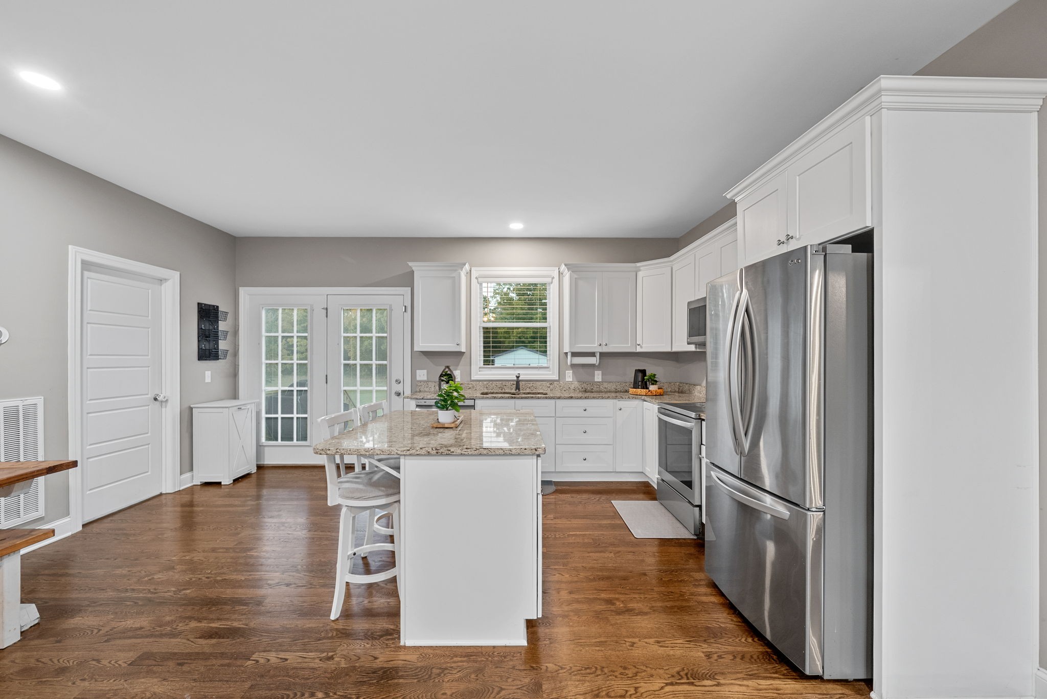 3762 Bowker Road Charlotte, TN 37036 - Photo 13 of 35 a kitchen with stainless steel appliances a refrigerator and wooden cabinets