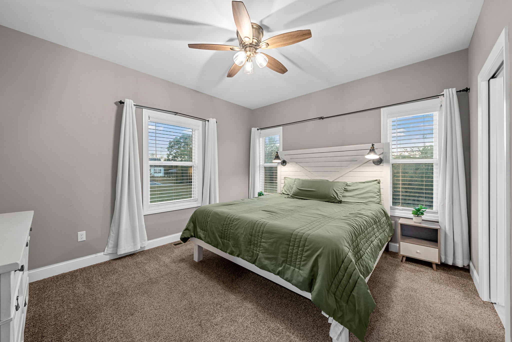 3762 Bowker Road Charlotte, TN 37036 - Photo 19 of 35 a bedroom with a bed dresser and a window