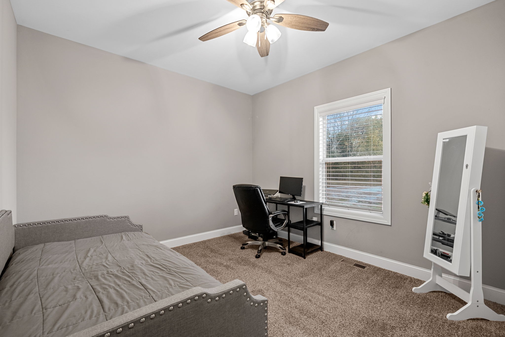 3762 Bowker Road Charlotte, TN 37036 - Photo 23 of 35 a bedroom that has a bed and chair