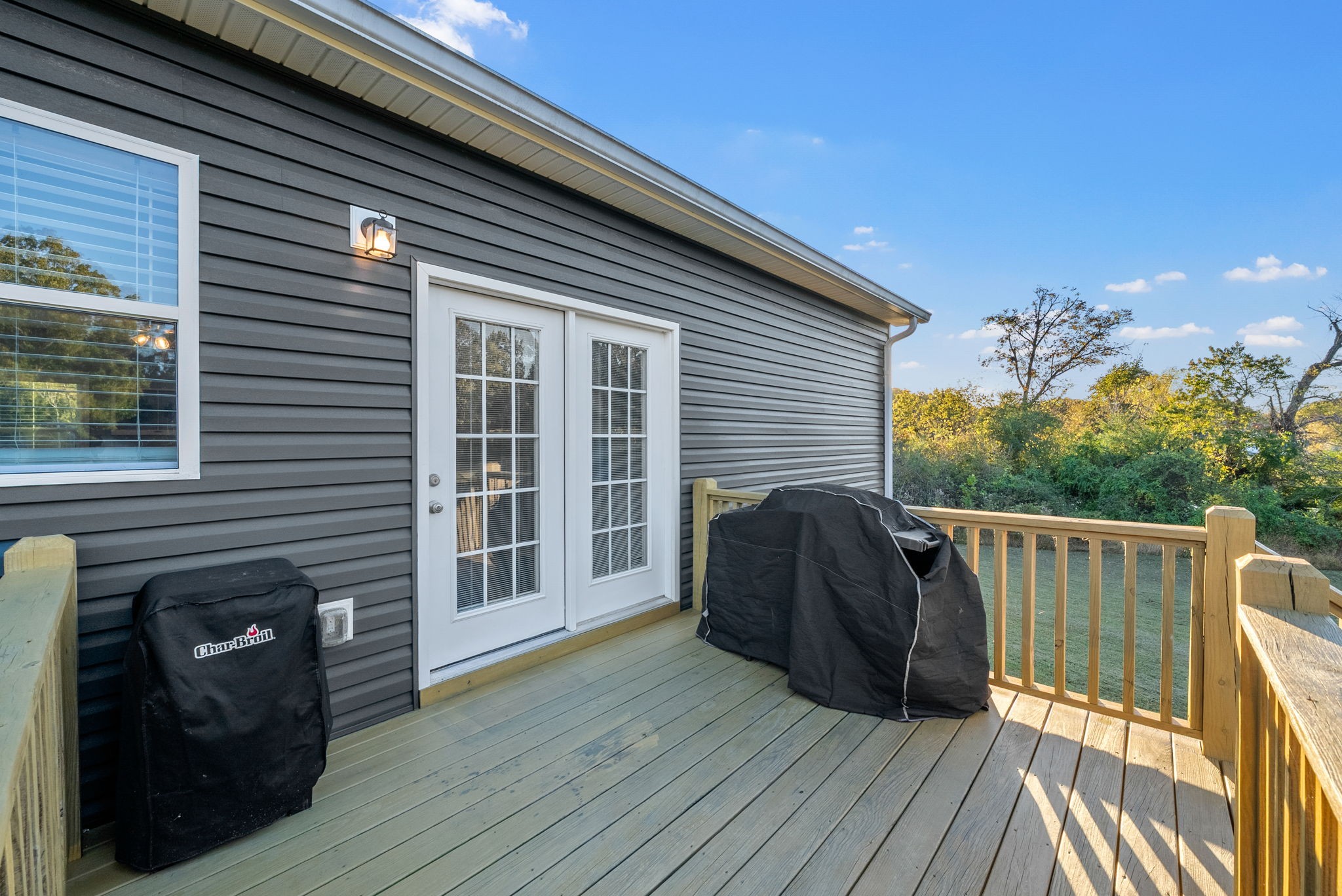 3762 Bowker Road Charlotte, TN 37036 - Photo 32 of 35 a view of a deck with wooden floor and seating space