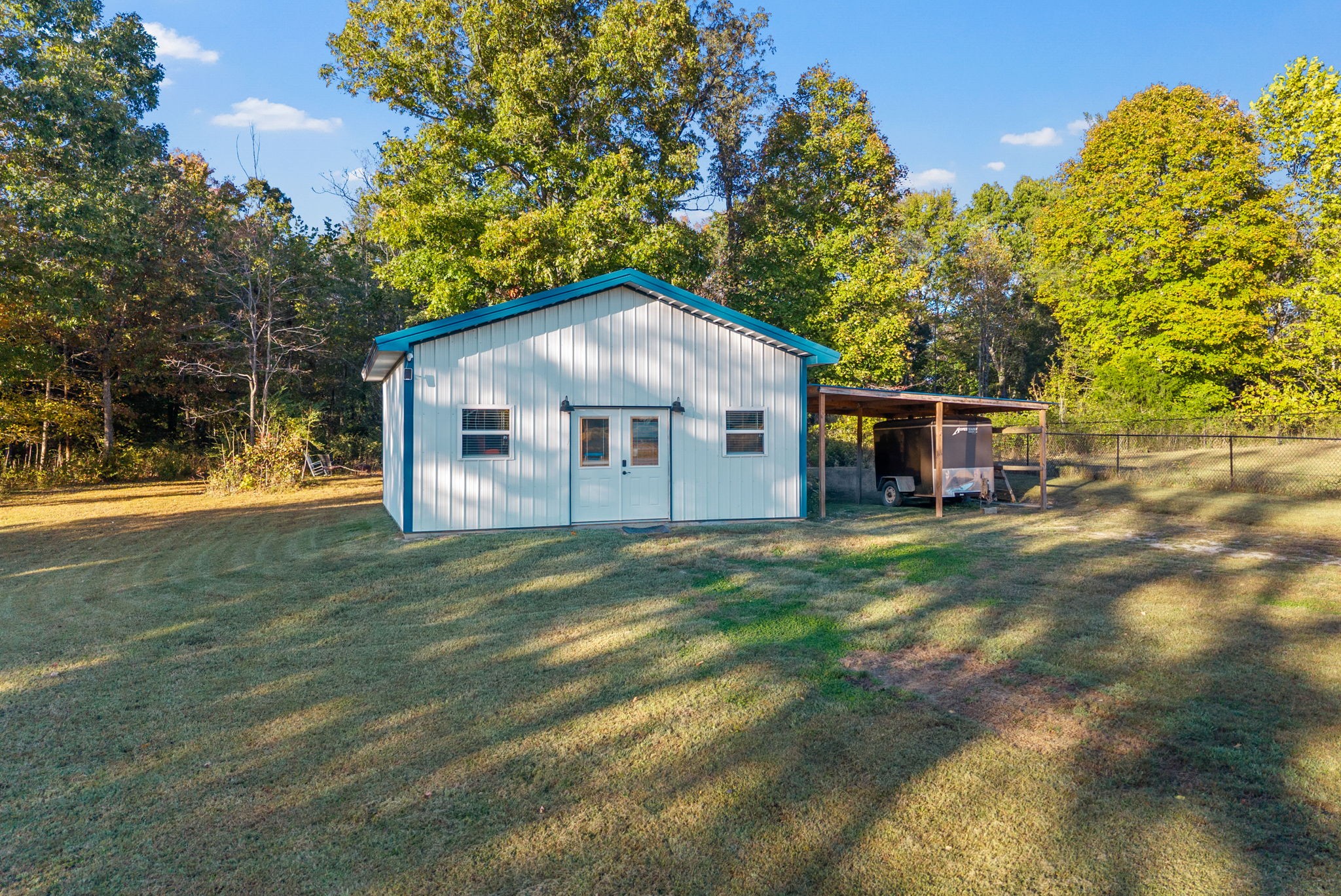 3762 Bowker Road Charlotte, TN 37036 - Photo 8 of 35 a front view of a house with a garden