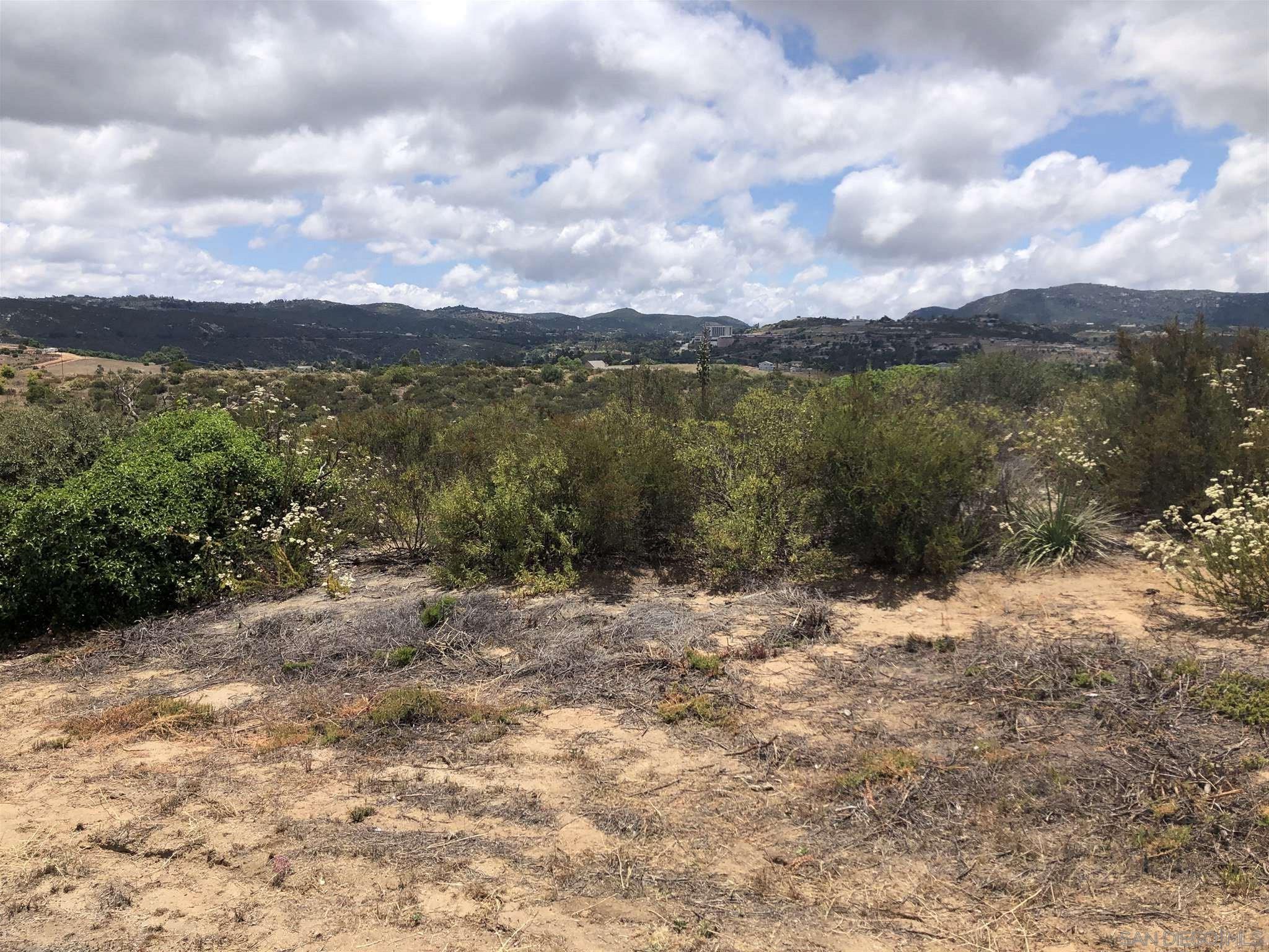 0 Sunset Road Valley Center, CA 92082 - Photo 12 of 20 a view of a lake with mountains in the background