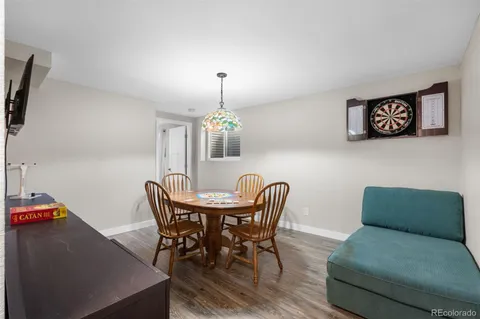 a view of a dining room with furniture and chandelier