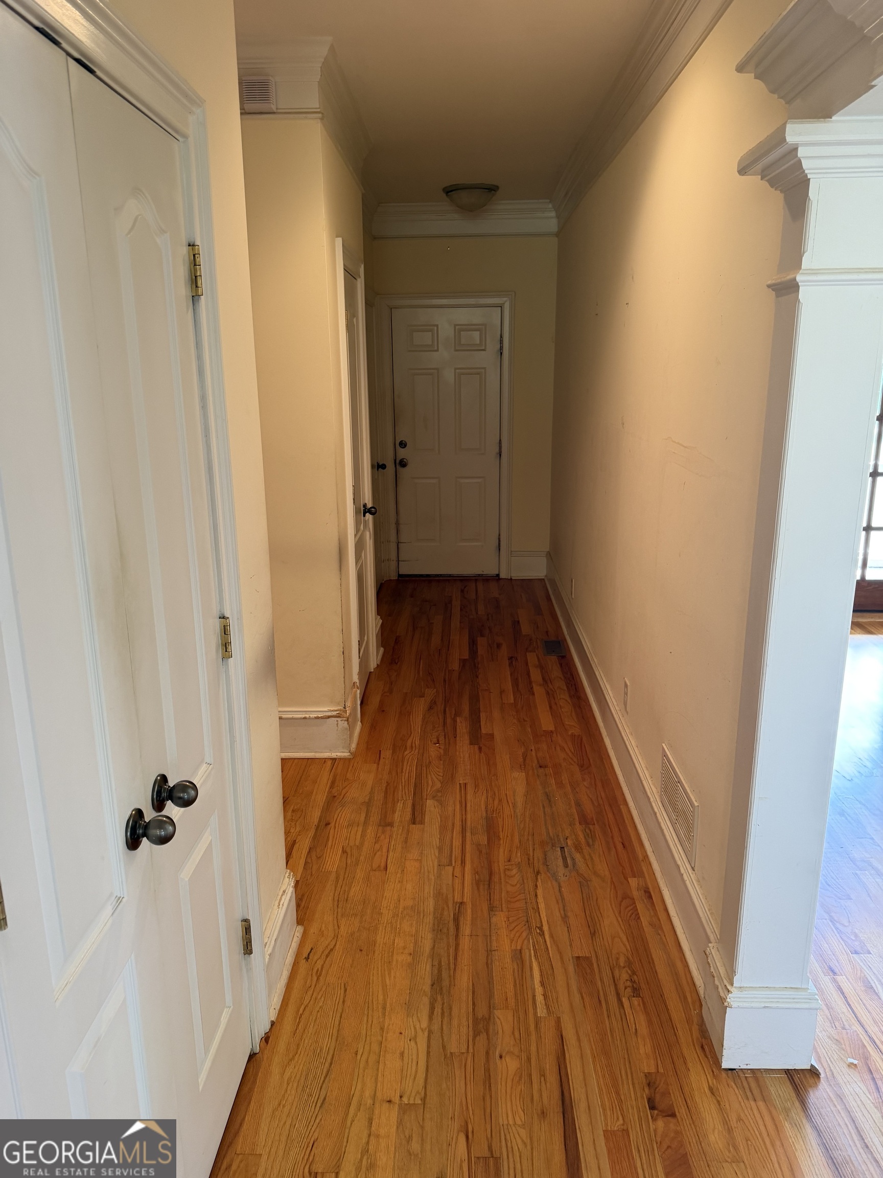 302 Norris Road Barnesville, GA 30204 - Photo 32 of 65 a view of a hallway with wooden floor and staircase