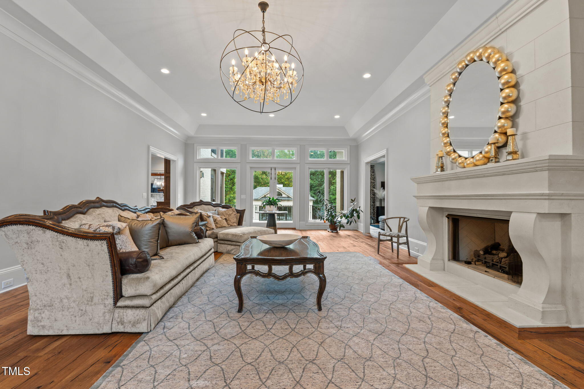 12660 Boyce Mill Road Raleigh, NC 27613 - Photo 12 of 89 a living room with furniture chandelier and a fireplace