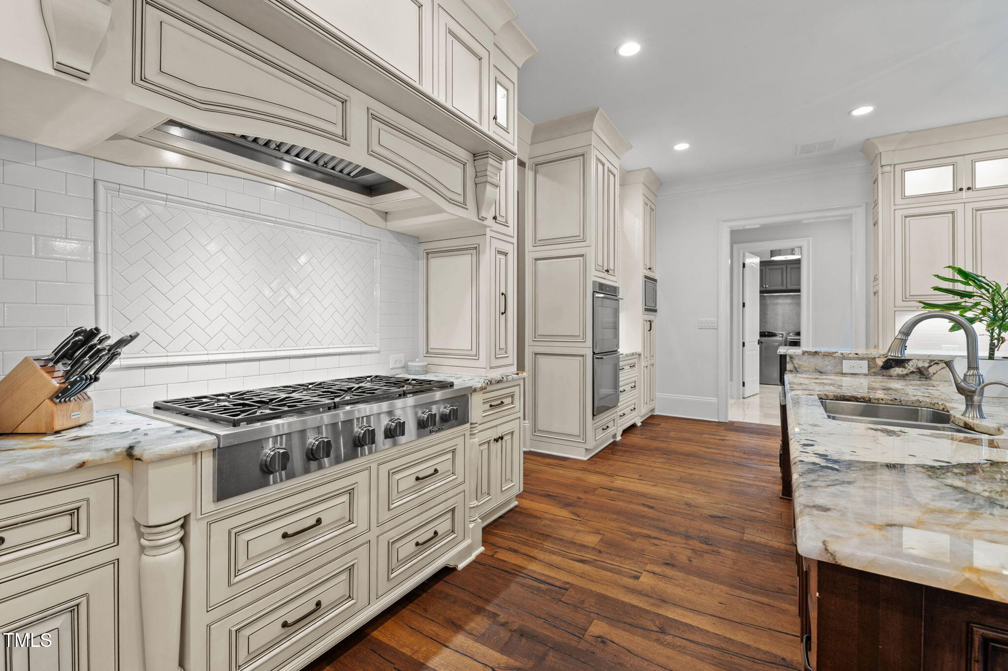 12660 Boyce Mill Road Raleigh, NC 27613 - Photo 18 of 89 a kitchen with granite countertop a stove and cabinets