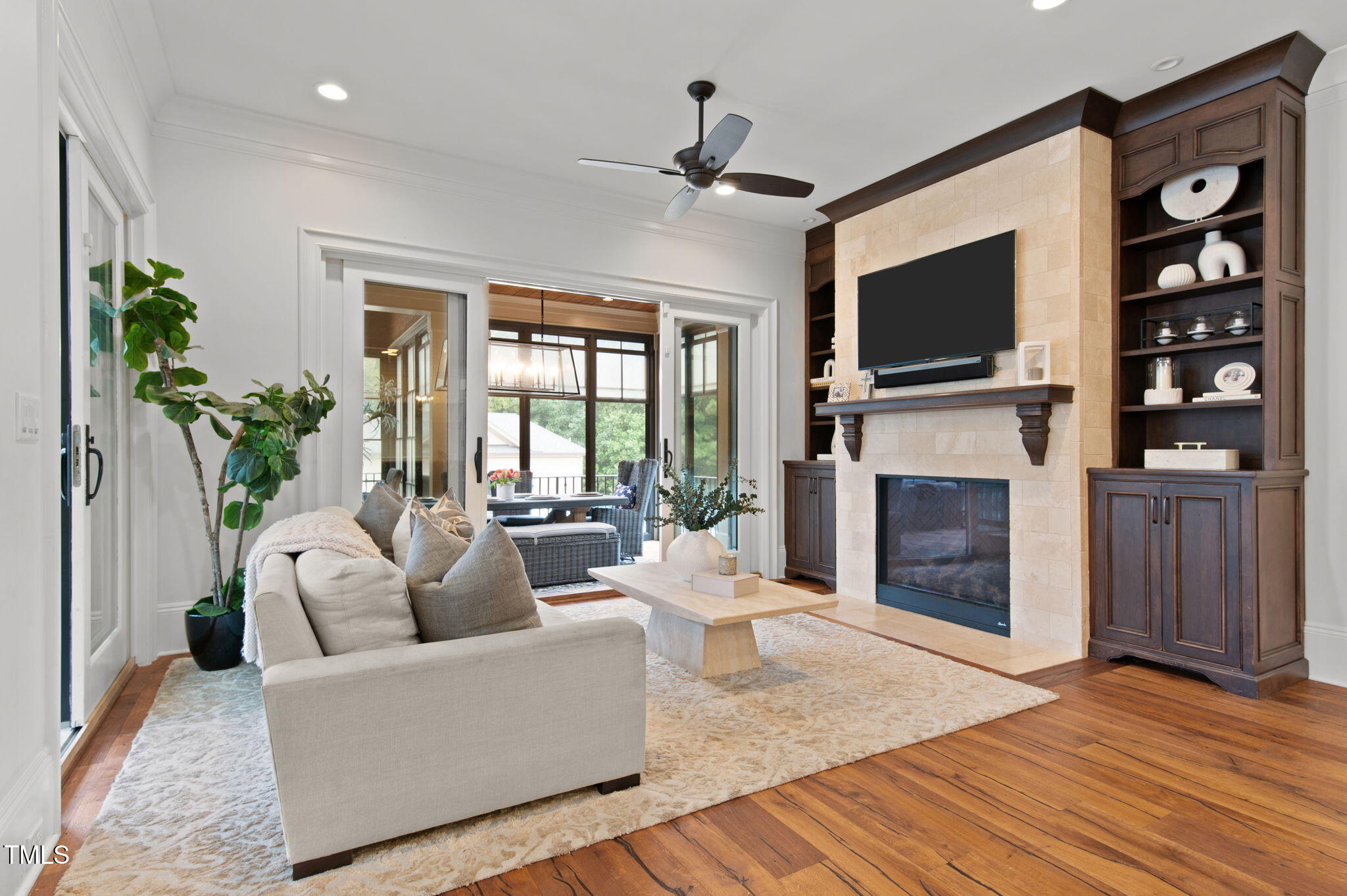 12660 Boyce Mill Road Raleigh, NC 27613 - Photo 21 of 89 a living room with furniture a fireplace and a flat screen tv