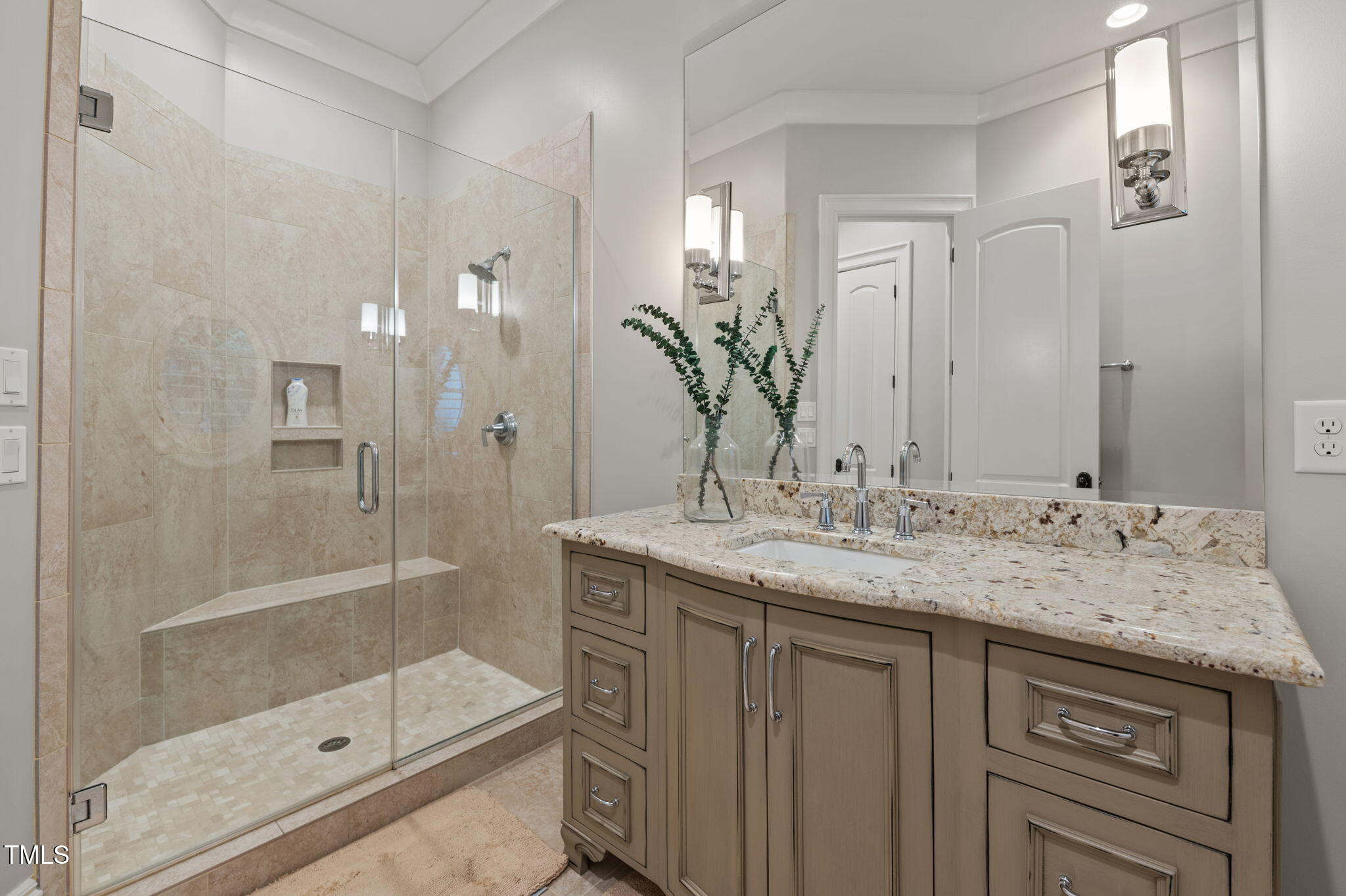 12660 Boyce Mill Road Raleigh, NC 27613 - Photo 45 of 89 a bathroom with a granite countertop sink a shower and a mirror