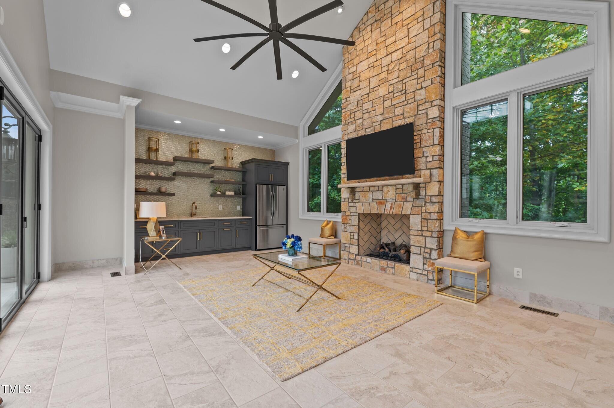 12660 Boyce Mill Road Raleigh, NC 27613 - Photo 48 of 89 a living room with furniture a flat screen tv and a fireplace