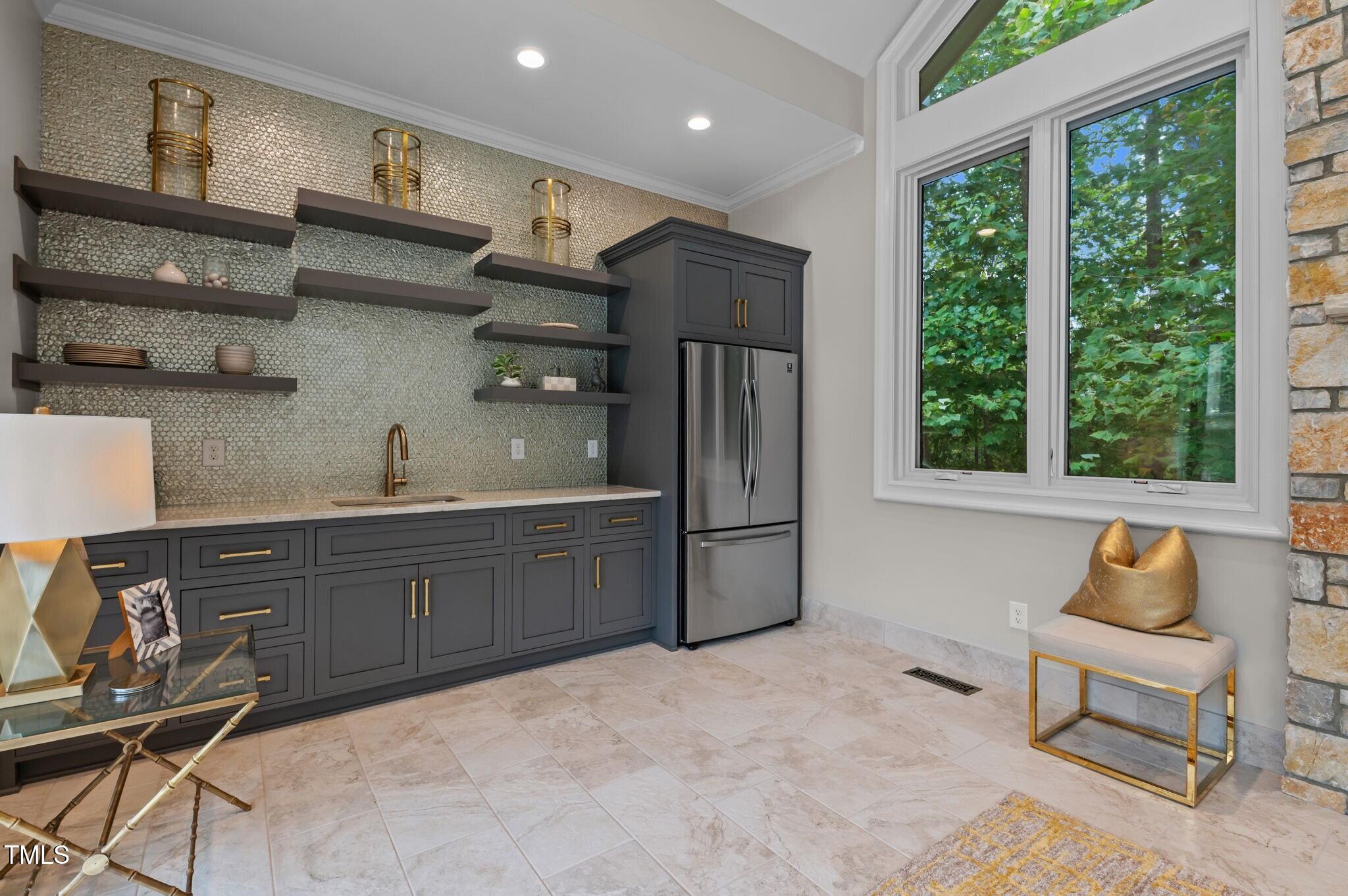 12660 Boyce Mill Road Raleigh, NC 27613 - Photo 49 of 89 a kitchen with stainless steel appliances granite countertop a refrigerator sink and wooden cabinets