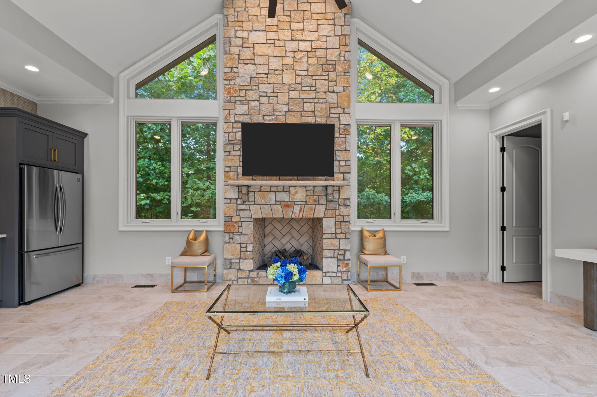 12660 Boyce Mill Road Raleigh, NC 27613 - Photo 50 of 89 a living room with furniture a fireplace and a flat screen tv