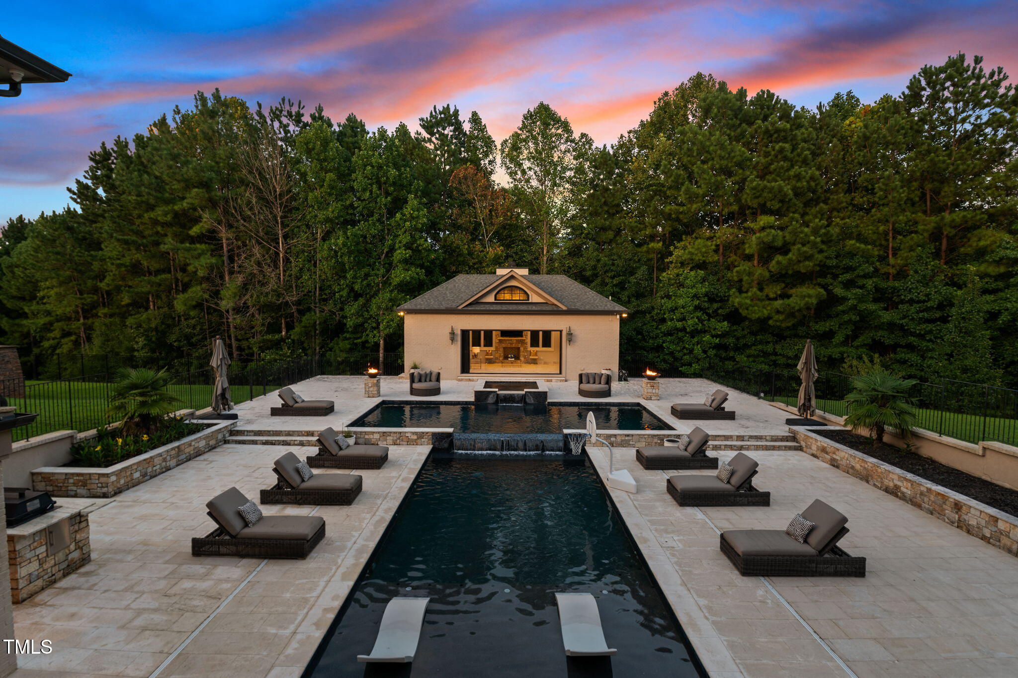 12660 Boyce Mill Road Raleigh, NC 27613 - Photo 66 of 89 a view of a patio with couches a table and chairs with wooden fence