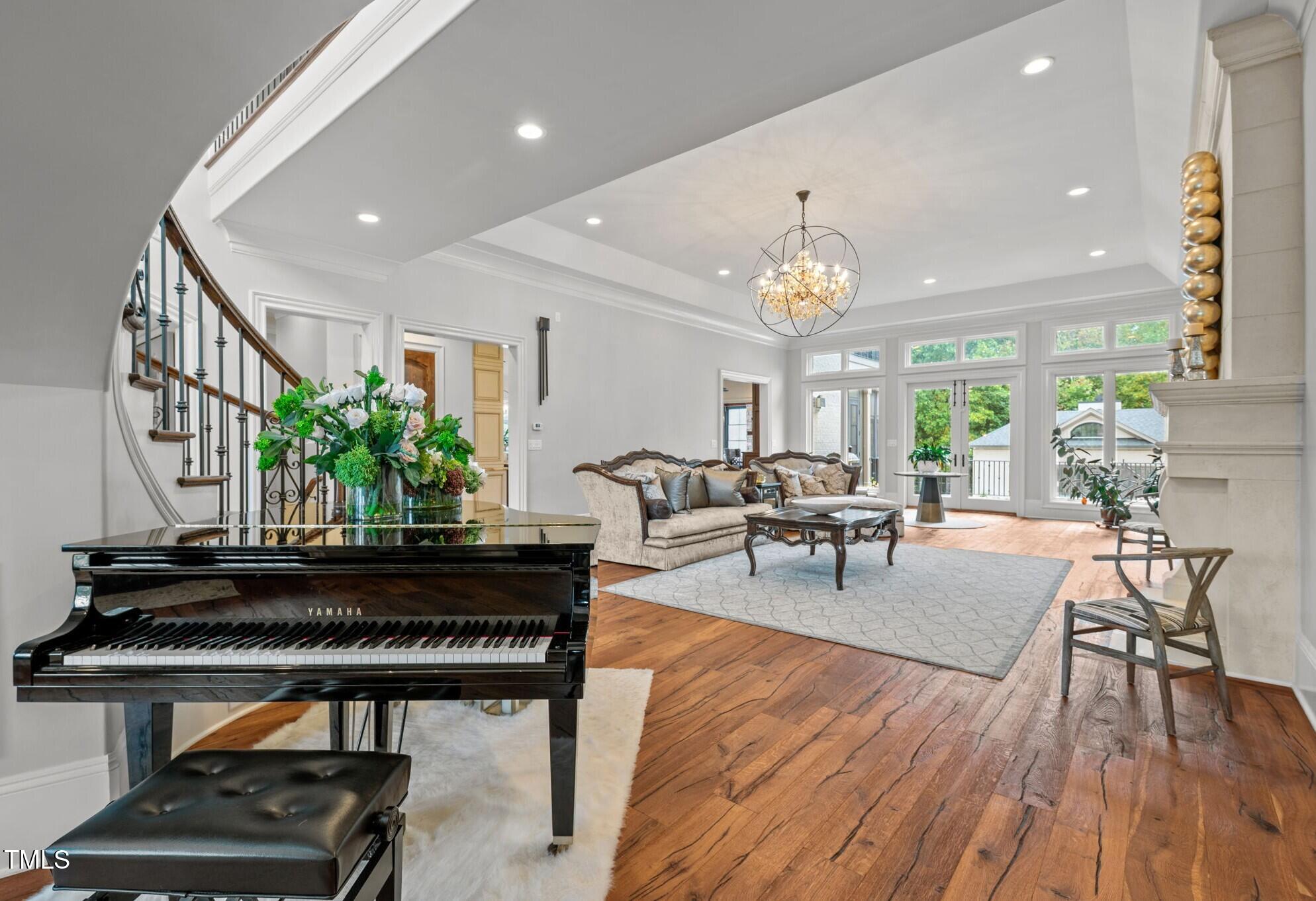 12660 Boyce Mill Road Raleigh, NC 27613 - Photo 10 of 89 a living room with furniture and a chandelier