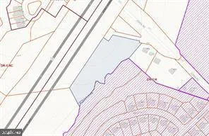 a view of a room with a window and wooden floor