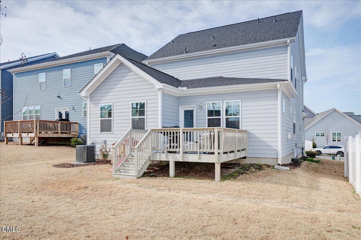 1105 Logperch Way Wendell, NC 27591 - Photo 12 of 29 a view of a house with backyard and sitting area