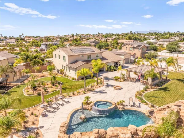 an aerial view of residential houses with outdoor space