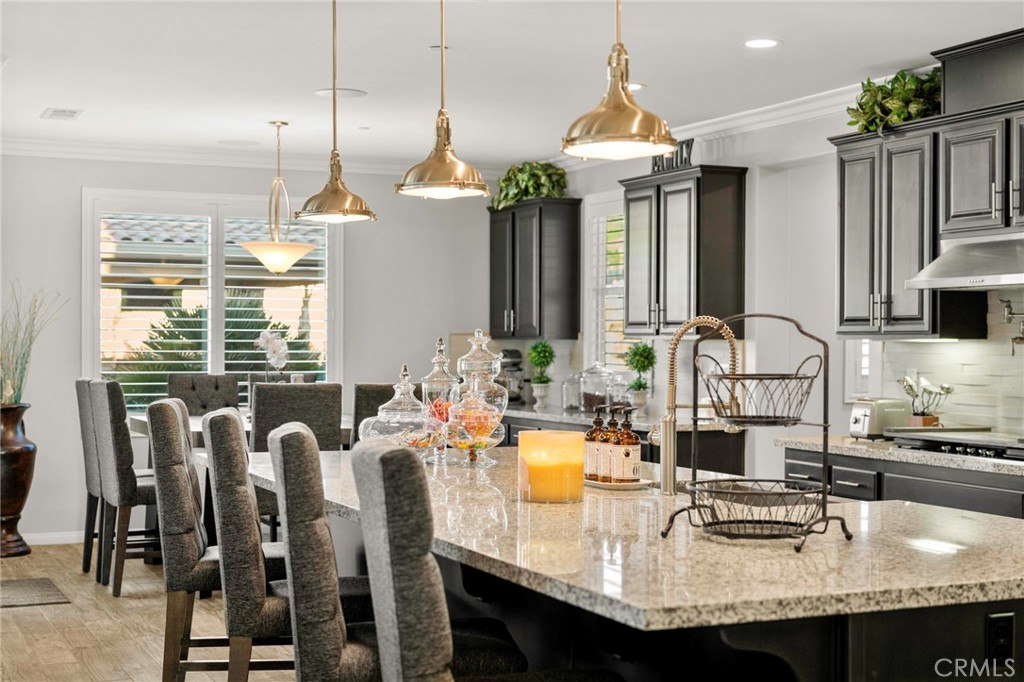 16555 Vía Los Caballeros Riverside, CA 92504 - Photo 15 of 51 a kitchen with granite countertop a sink and cabinets