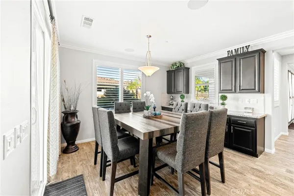 a view of a dining room with furniture and window