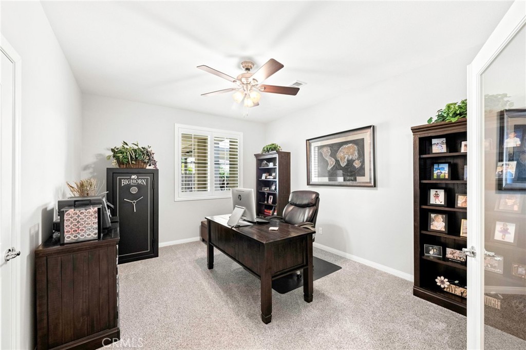 16555 Vía Los Caballeros Riverside, CA 92504 - Photo 19 of 51 a living room with furniture and wooden floor