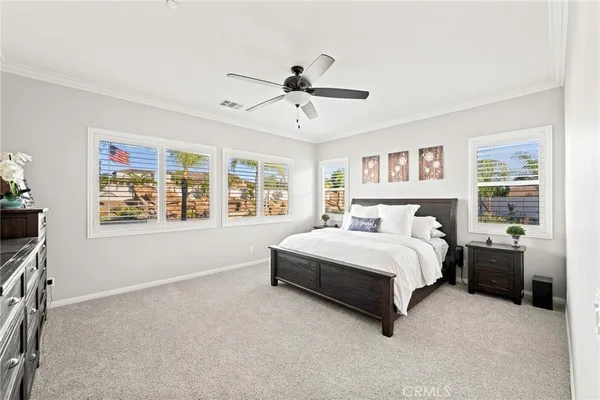 a spacious bedroom with a large bed and a window