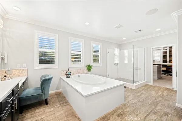 a spacious bedroom with a large bed and a window