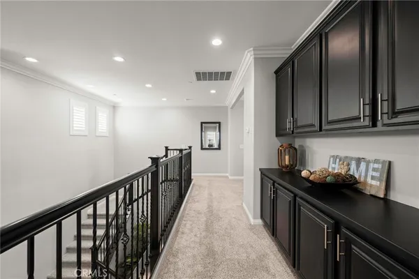 a kitchen with sink cabinets and stove