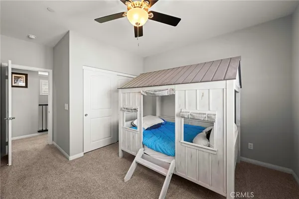 a bedroom with furniture and a chandelier