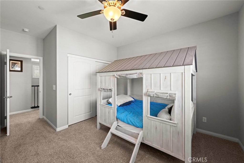 16555 Vía Los Caballeros Riverside, CA 92504 - Photo 26 of 51 a bedroom with furniture and a chandelier