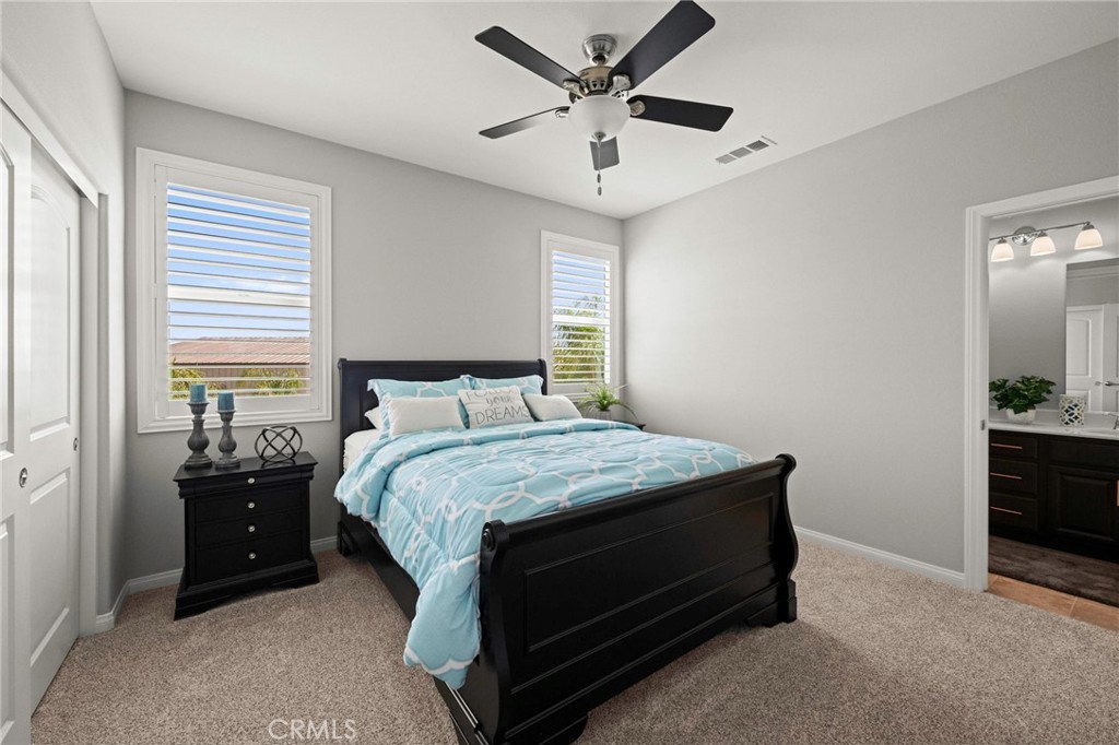 16555 Vía Los Caballeros Riverside, CA 92504 - Photo 28 of 51 a bedroom with a bed and a potted plant