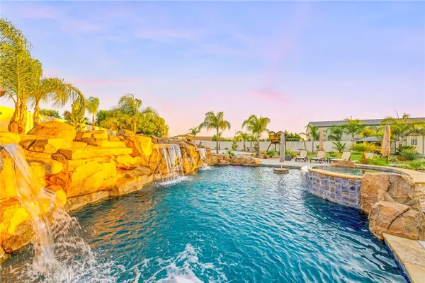 a view of a patio with table and chairs and potted plants