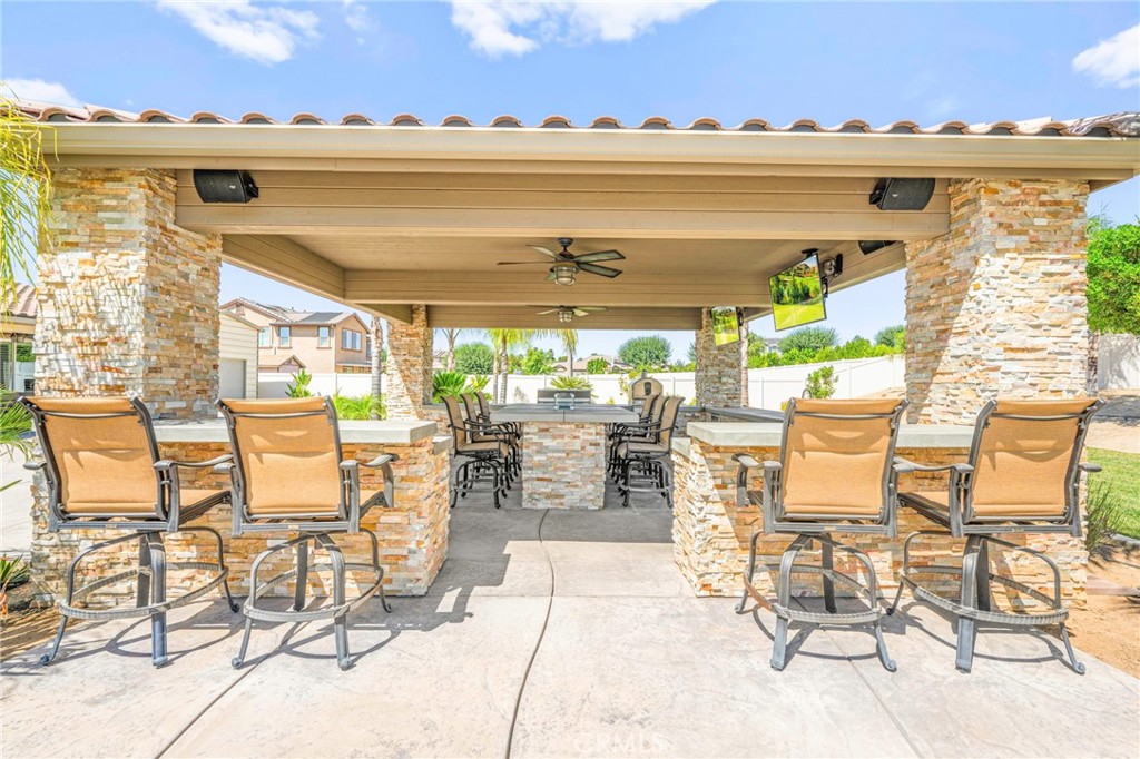 16555 Vía Los Caballeros Riverside, CA 92504 - Photo 40 of 51 a view of a patio with table and chairs and potted plants