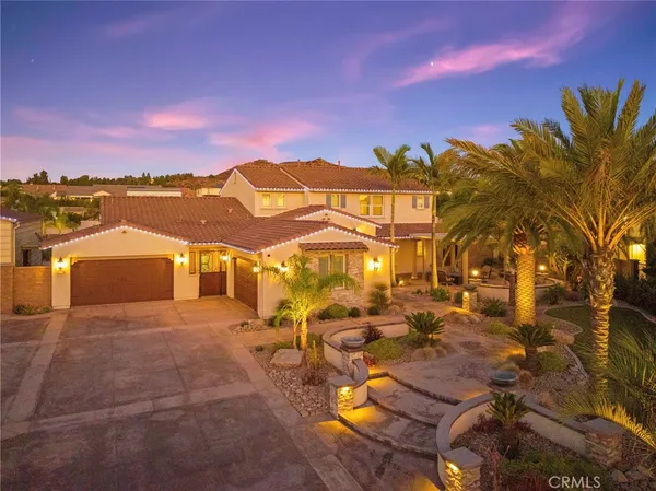 a view of a swimming pool with a table and chairs