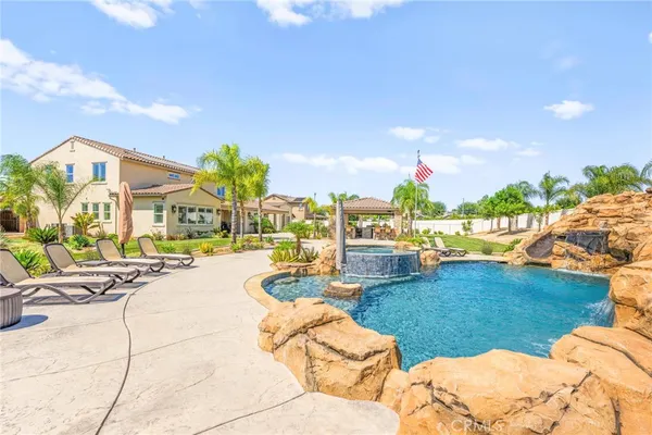 a view of a lake with couches and city view