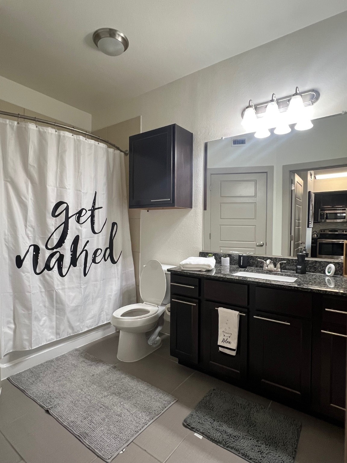 145 Heights Boulevard, Unit 363 Houston, TX 77007 - Photo 7 of 10 a spacious bathroom with a bathtub sink and toilet