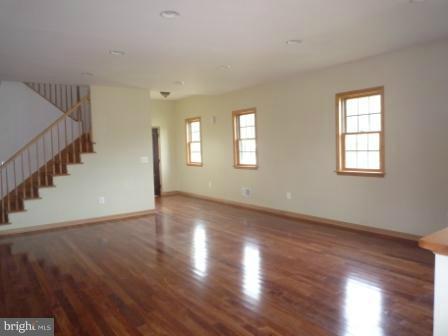 1302 Goose Neck Road Middle River, MD 21220 - Photo 14 of 29 a view of an empty room with wooden floor and a window