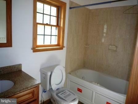 1302 Goose Neck Road Middle River, MD 21220 - Photo 3 of 29 a bathroom with a sink toilet and shower