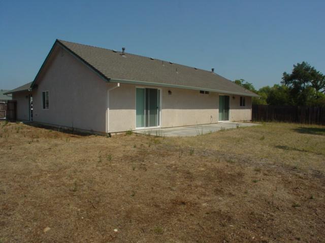 7764 Pit Road Redding, CA 96001 - Photo 2 of 8 a house that has a big yard