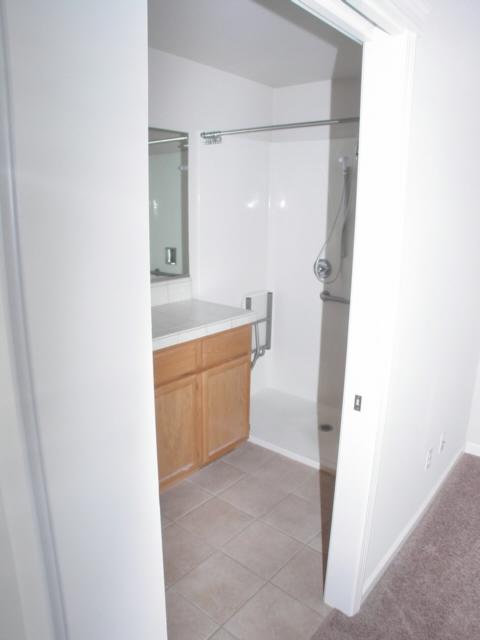 7764 Pit Road Redding, CA 96001 - Photo 7 of 8 a bathroom with a bathtub sink and toilet