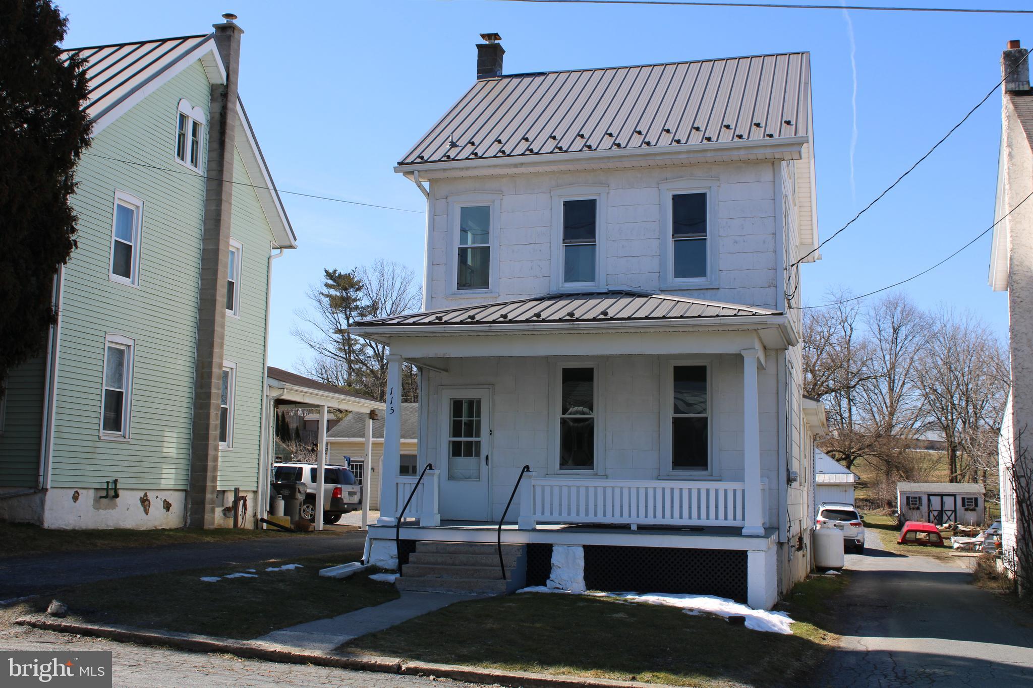 115 Spring Grove Road East Earl, PA 17519 - Photo 1 of 16 a view of a white building with many windows