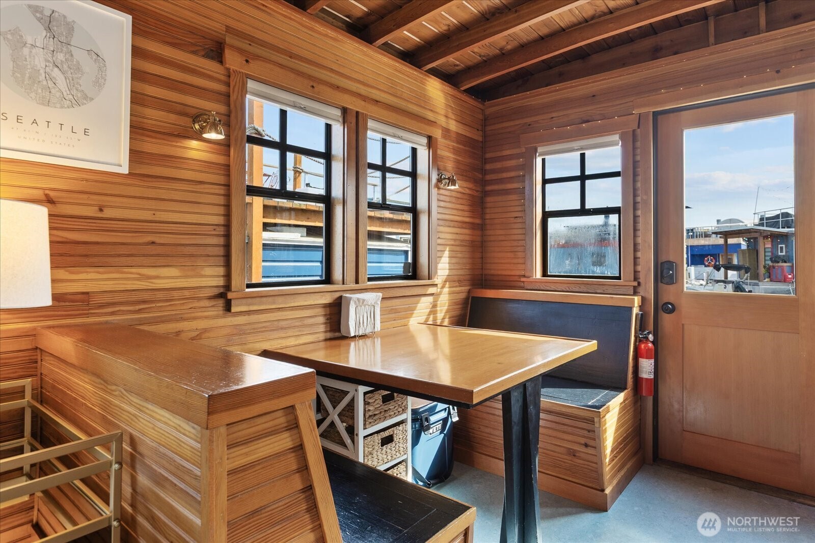 2401 North Northlake Way, Unit E7 Seattle, WA 98103 - Photo 7 of 23 a view of a dining room with furniture and window