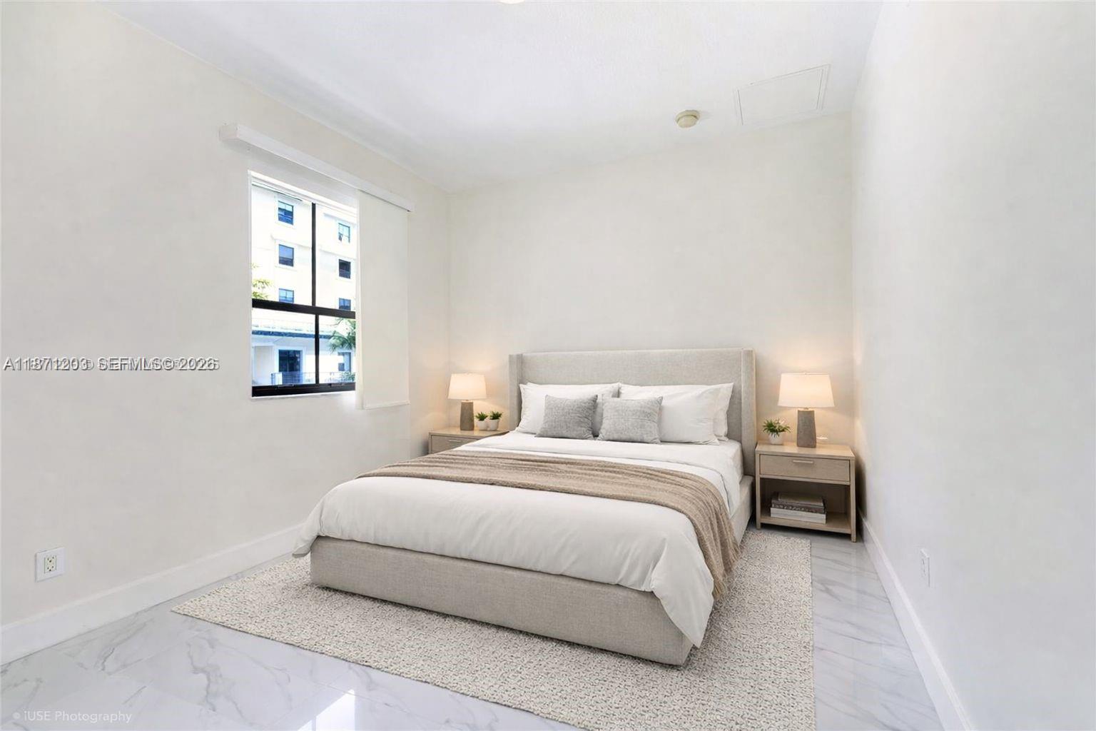 8395 Southwest 73rd Avenue, Unit 511 Miami, FL 33143 - Photo 11 of 18 a bedroom with a bed and a window