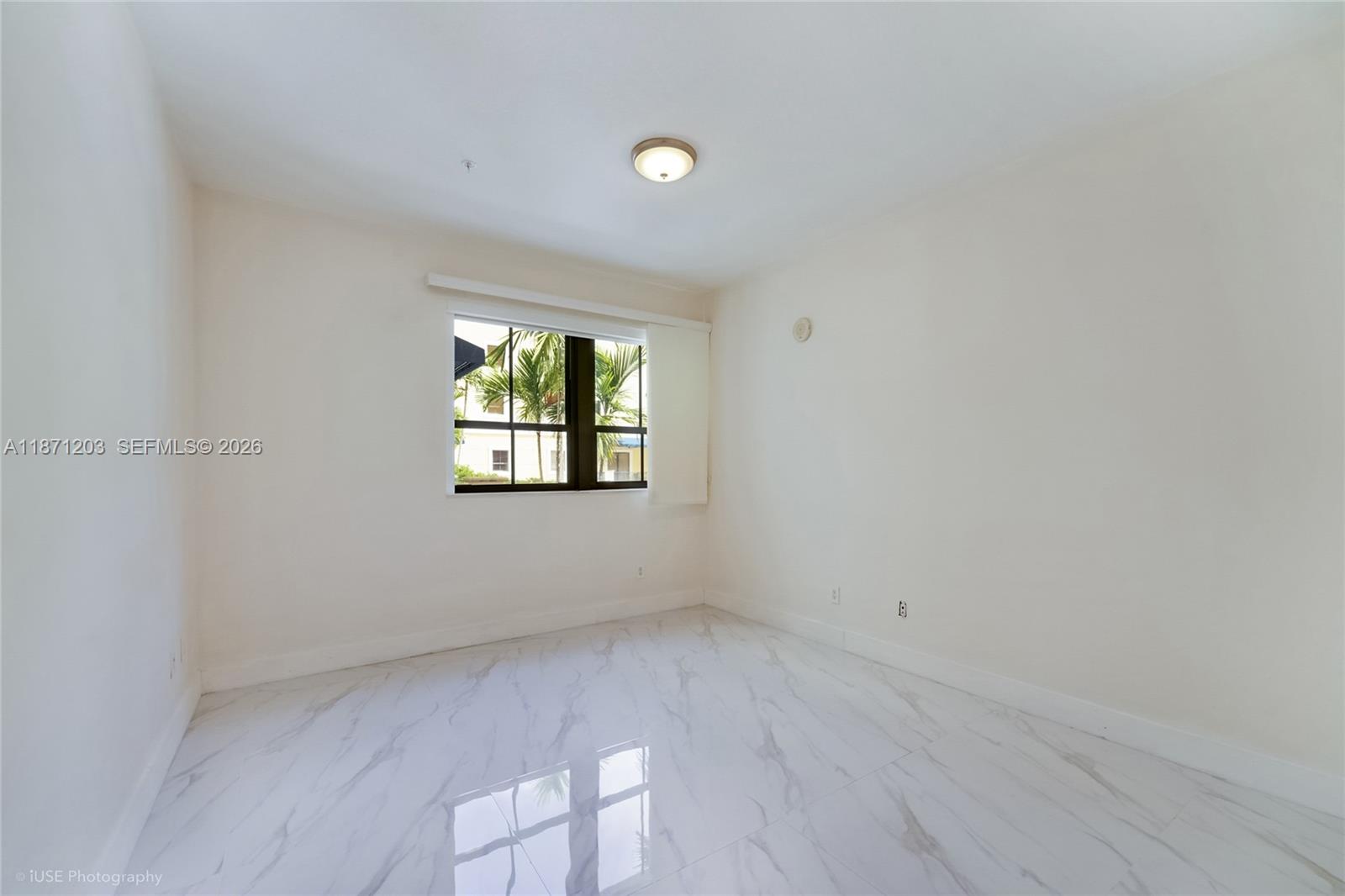 8395 Southwest 73rd Avenue, Unit 511 Miami, FL 33143 - Photo 14 of 18 an empty room with a window